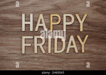 Happy Friday text message on wooden background Stock Photo