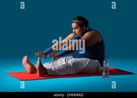 Young fat man doing yoga Stock Photo - Alamy