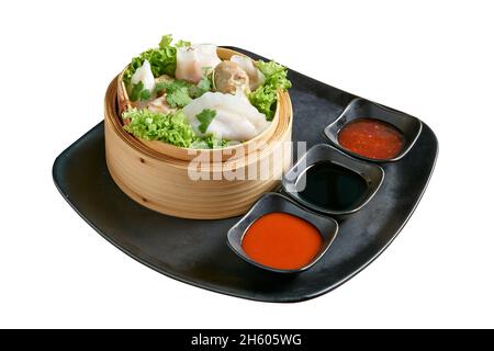 Overhead view on Dim Sum in Bamboo Basket isolated on white with clipping path Stock Photo