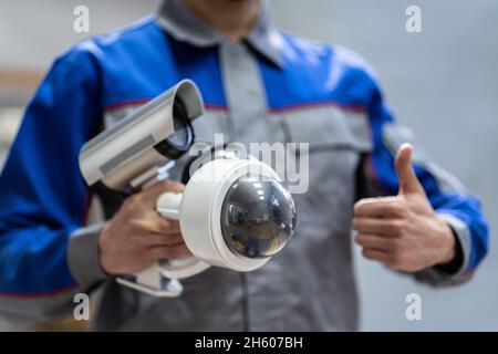 Technician Using Surveillance Security Camera Video System Stock Photo