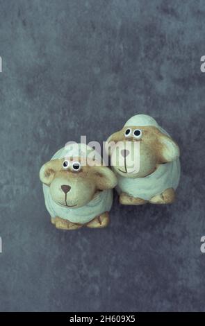 Two caricature models of sheep looking inquisitively  to viewers left Stock Photo