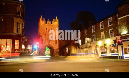 traffic passing micklegate bar at twilight york united kingdom Stock Photo