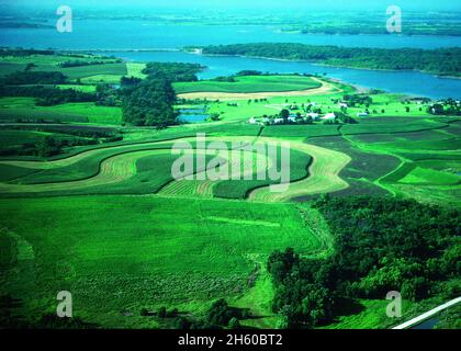 Contour stripcropping is among the best practices that protects the soil against erosion and helps keep sediment and farm chemicals out of the water in Red Rock Lake in central Iowa. ca. 2011 or earlier Stock Photo