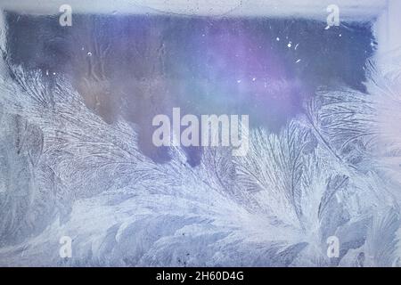 natural frosty patterns on the window glass gradient illumination Stock Photo