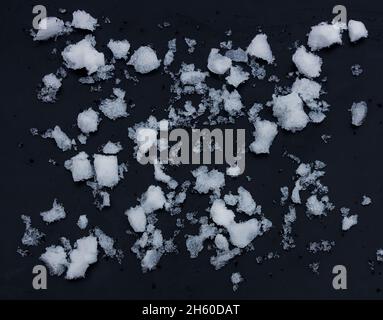 snow chunks lumps texture of snow on a black background Stock Photo