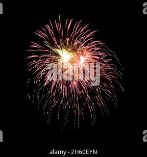 Colorful fireworks isolated on black sky background. Stock Photo