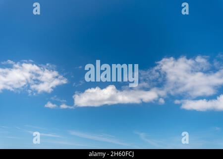 Background with blue sky and white clouds. Stock Photo