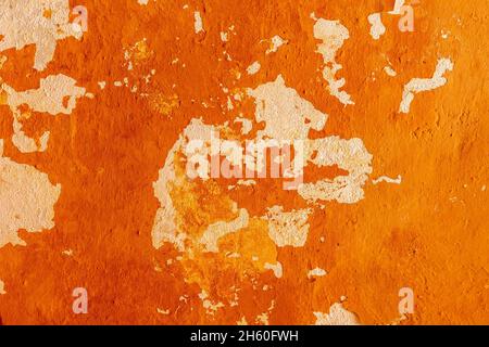 Old concrete wall with cracks and chipped texture. Stock Photo
