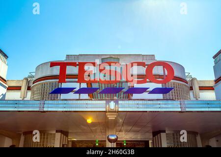 Entrance to Tesco supermarket at the back of the Art deco Hoover Building, former headquarters of The Hoover Company, Perivale, London, UK Stock Photo