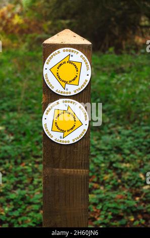 A Norfolk County Council Public Footpath sign on Alderford Common SSSI site at Alderford, Norfolk, England, United Kingdom. Stock Photo