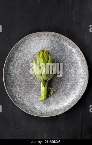 Artichokes on a plate. Stock Photo