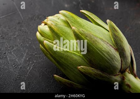 Artichokes on a black background. Stock Photo