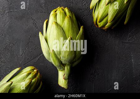Artichokes on a black background. Stock Photo