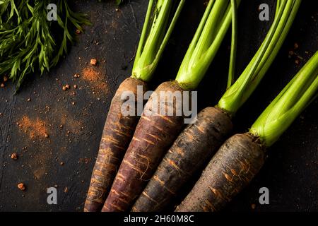 close up of carrots on a black background. Stock Photo