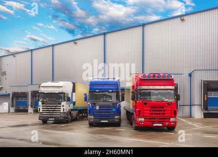 Parking trucks in warehouse, Freight transportation Stock Photo