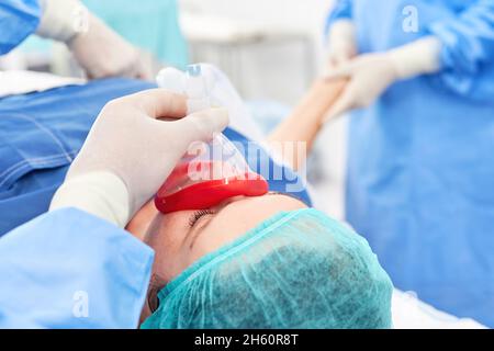 An emergency patient is anesthetized and ventilated in the trauma surgery Stock Photo