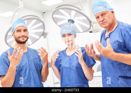 Surgery team with sterile hands after disinfection before an operating room in the operating room Stock Photo
