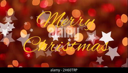Image of christmas stars falling over merry christmas text on blurred red background Stock Photo