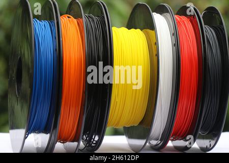 Varieties of color plastic filament in reels for printing on a 3D printer Stock Photo