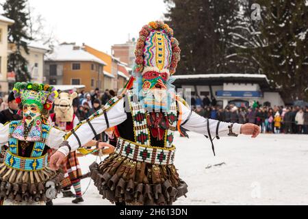 Razlog, Bulgaria - January 14, 2017: People in traditional carnival kuker costumes at Kukeri festival Starchevata Stock Photo