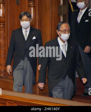 Tokyo, Japan. 12th Nov, 2021. Japan's Emperor Naruhito(L) wearing a face mask and New speaker of the House of Representatives Hiroyuki Hosoda(Front R) arrives at the opening ceremony of the 206th Special Diet session at the National Diet in Tokyo, Japan on Friday, November 12, 2021. Photo by Keizo Mori/UPI Credit: UPI/Alamy Live News
