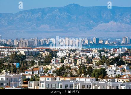 View overlooking Protaras, Paralimni district, Republic of Cyprus and the abandoned hotels of Varosha, Famagusta, Northern Cyprus beyond. Stock Photo