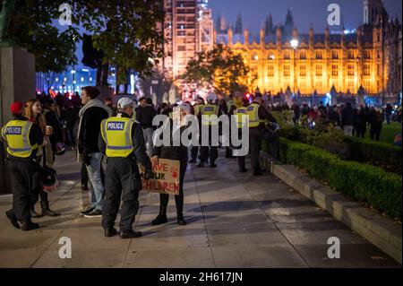 Police officer and a protester clash during the overnight clearance of ...