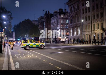 LONDON - NOVEMBER 1, 2021: Paramedic 4x4 with many police vans in the background on Whitehall during The Million Mask March Stock Photo