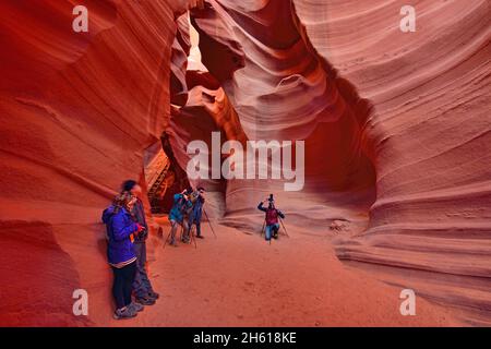 Photographing the eroded Navajo Sandstone in the Lower Antelope Canyon, Page, Arizona, USA Stock Photo