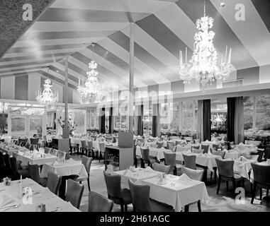 Interior and empty tables at the Candlelight Restaurant, Central Ave., Yonkers, New York; 1954 Stock Photo