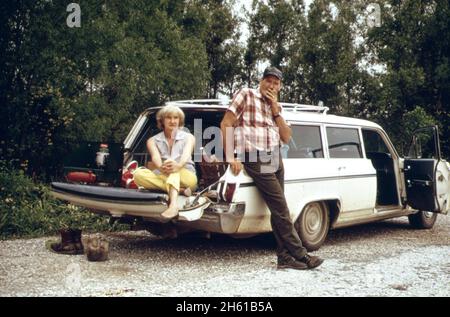 Owl Bayou on Highway 51 between Laplace and Manchac, husband and wife wait while sons fish in the nearby bayou; Louisiana ca. April 1973 Stock Photo