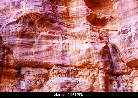 View of prehistoric petroglyphs and inscriptions in the rocks cliffs, Wadi Rum, desert park in Southern Jordan Stock Photo