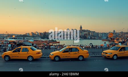 sunset on Istanbul skyline of the city with the Galata Tower landmark on the side of Beyoglu district, on the other side of the Golden Horn, Eminonu d Stock Photo