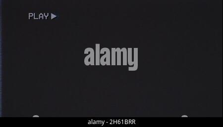 Overlay old damaged VHS tape with tv flicker antenna noise: play. Cool retro vintage background for modern videos. Stock Photo