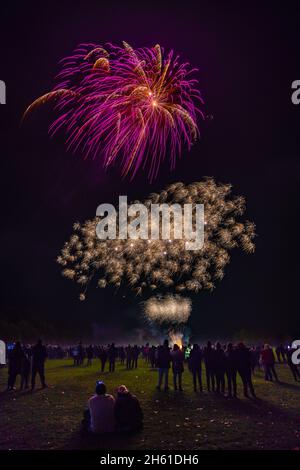 Commercial Fireworks Display in a large open field on 5th November, Guy Fawkes night in England, UK. Stock Photo