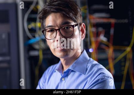Portrait of asian male engineer in computer server room Stock Photo