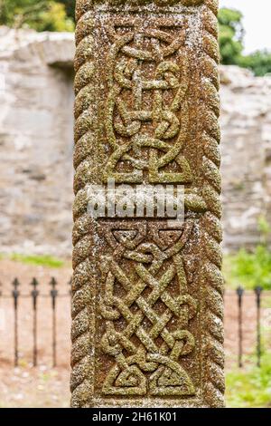 Celtic knot details carved in stone on a Celtic cross in Johnstown old church, County Kildare, Ireland Stock Photo