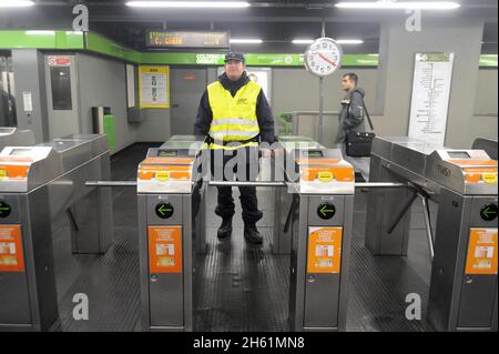 - Milan subway station Famagosta, private guards in security service   - Milano, stazione Famagosta della Metropolitana, guardie private in servizio di sicurezza Stock Photo