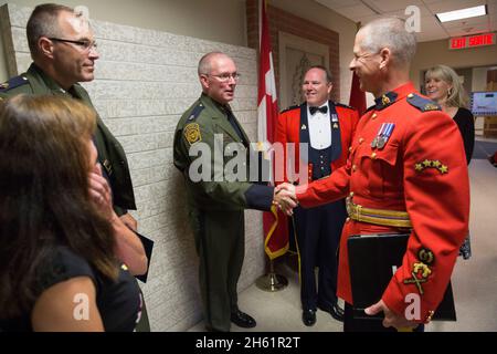 U.S. Border Patrol Academy Chief Dan Harris visits the Royal Canadian Mounted Police Academy to observe graduation exercises of Troop 30 of the RCMP in Regina, Canada, Aug. 7, 2017. Chief Harris also delivered remarks to the graduating class of new officers during an evening banquet. Stock Photo