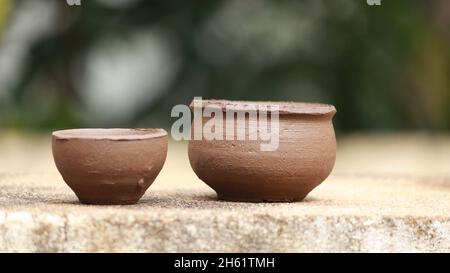 The pottery made by the boys for playing with the clay is left to dry in the awning Stock Photo
