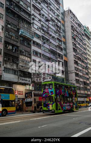 urban canyon and double decker buses in hong kong Stock Photo