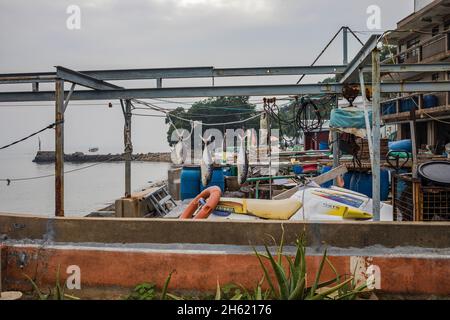 Small Fishing Net Hangs from a Wooden Mast of a Traditional