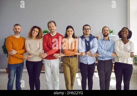 Diverse people group different generation and race ethnicity holding hands Stock Photo