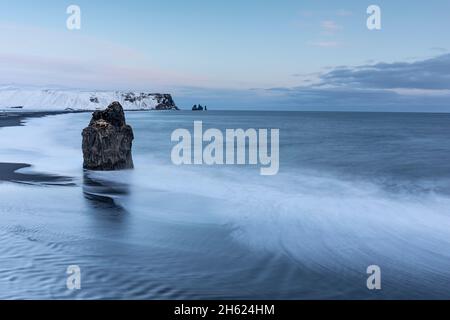 view from cape dyrholaey to the black beach reynisfjara. Stock Photo