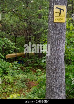 camping in canada,ontario,kawartha highlands provincial park,canoe portage,path,trail marker on a tree Stock Photo