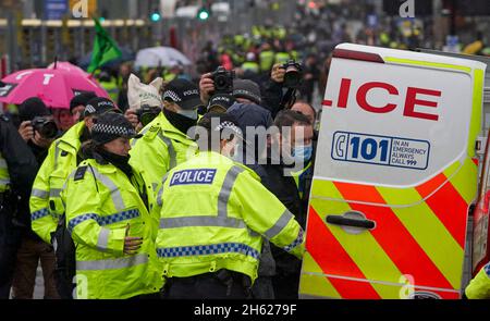 Police arrest demonstrator during COP26 in Glasgow, Scotland.Outside delegates entrance to Scottish Events Campus. 12th November 2021 4pm. Stock Photo