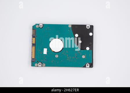 Old internal hard drive computer on white background, technology drive storage on isolated background, HDD notebook laptop hard drive 2,5 " inch botto Stock Photo
