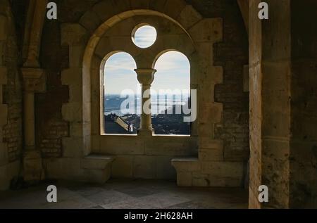 The Fisherman's Bastion is located atop the Castle Hill of Buda, the windows of its towers open the view on the city, Danube River, bridges and blue s Stock Photo