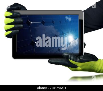 Manual Worker with work gloves showing a digital tablet computer with a solar panel inside the screen. Isolated on white background. Solar energy. Stock Photo