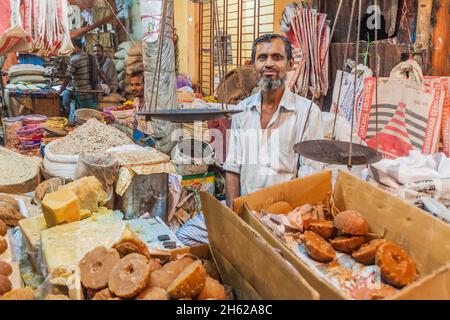 KHULNA, BANGLADESH - NOVEMBER 12, 2016: Local seller at a market in Khulna, Bangladesh Stock Photo